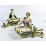 A pair of Continental style figural salt cellars