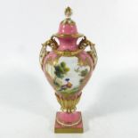 A Royal Worcester pedestal vase and cover