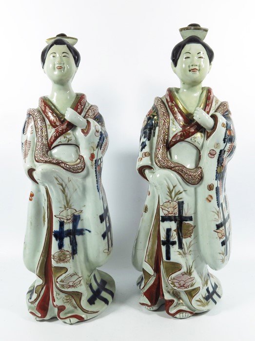 A large pair of Japanese Imari figures