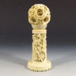 A 19th century Chinese carved ivory puzzle ball on stand