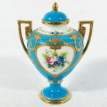 A small Minton twin handled vase and cover