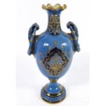 A Vienna style porcelain tin handled pedestal vase