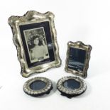 Four Elizabeth II silver photo frames