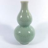 A Chinese celadon double gourd vase