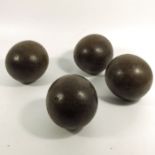 Four 18th century wooden bowling balls