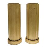 A pair of fluted column display pedestals
