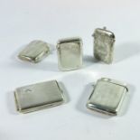A collection of five Edwardian and later silver vesta cases