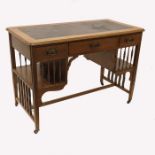 An Arts and Crafts walnut desk, in the style of J S Henry
