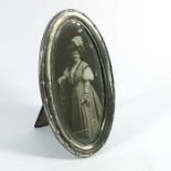 An Edwardian silver oval photo frame, Mitchell Bosley & Co