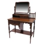 An Arts and Crafts walnut dressing table