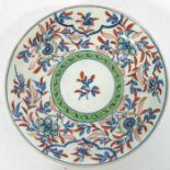 A Worcester clobbered tea bowl and saucer