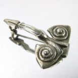 Liberty and Co., an Arts and Crafts Cymric silver brooch