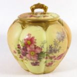 A Royal Worcester blush ivory biscuit barrel or vase and cover