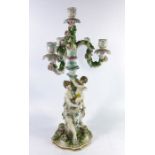 A Continental porcelain figural three branch candelabrum