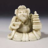 A 19th century Japanese carved ivory okimono