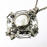 An Arts and Crafts silver and mother of pearl pendant,