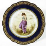A Limoges porcelain plate, painted with a girl