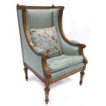 A Louis XVI style giltwood armchair