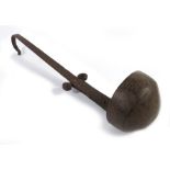 An 18th century wrought iron ladle or lamp