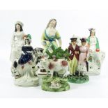 A collection of six Staffordshire slipware figures