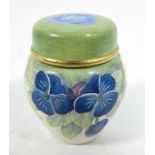 A miniature Moorcroft enamelled Pansy on white ginger jar