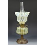 An Arts and Crafts straw opal glass oil lamp