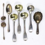 A collection of George III and later silver salt spoons and a caddy spoon