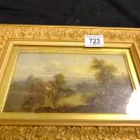 An oil painting of a lake scene, gilded frame