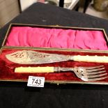 A fish serving knife and fork, cased