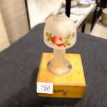 A lamp with painted floral scene, mounted on woode