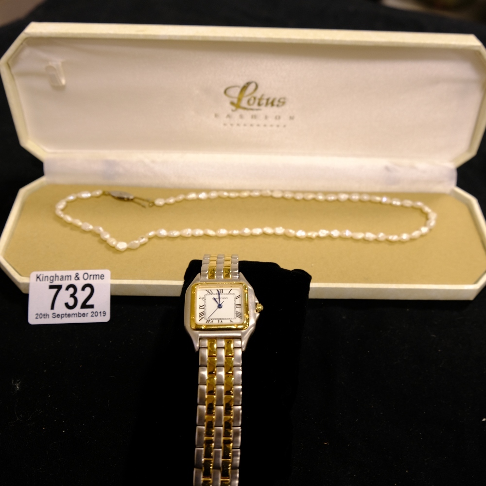 A ladies Cartier watch together with a necklace