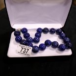 A large blue bead necklace