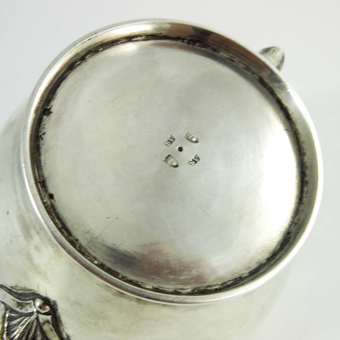 A mid 18th century Scottish provencial silver teaport, circular shape, floral decoration to the spou - Image 6 of 6