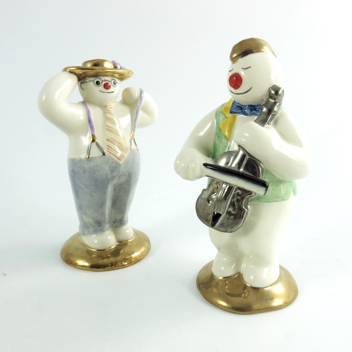 Two Royal Doulton snowmen figures, Stylish and Cellist, gold and silver highlights colourway, proper