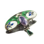 An Arts and Crafts silver and enamelled brooch