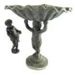 A 19th century lead figural tazza, modelled as a putto holding a conch shell above his head, togther