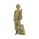 λ A 19th century Japanese ivory okimono, Meiji, modelled as a father and son, 15cm high