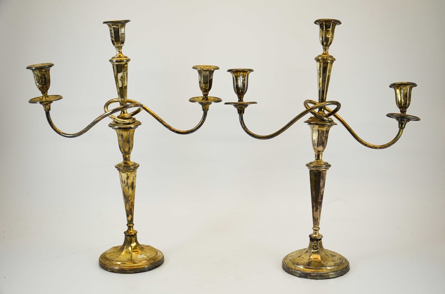 A pair of Edwardian three branch silver candlebras, Walter Latham & Son, Sheffield 1910, 50cm high,