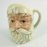 A Royal Doulton small character jug, Santa Claus, with a white handle, 11cm high