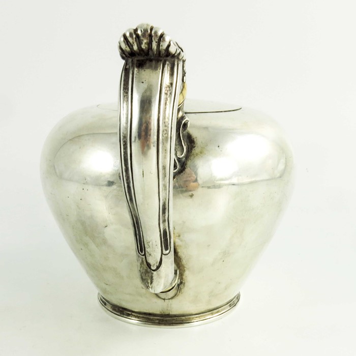 A mid 18th century Scottish provencial silver teaport, circular shape, floral decoration to the spou - Image 4 of 6