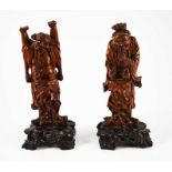 A pair of Chinese carved hardwood figures, 19th century