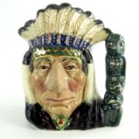 A Royal Doulton small character jug, North American Indian, green totem pole, gold highlights colour