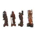 Four Chinese carved hardwood figures, modelled as deities and old men