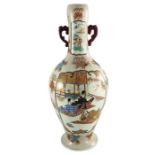 A large Japanese Imari twin handled vase, painted with panels of figures with a volcanic background,