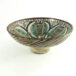 A large Iznik globe and shaft vase, together with a Moroccan faience pomegranate bowl