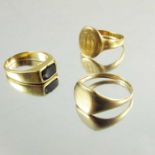 Two signet gold rings, one 15ct, together with yellow metal ring, weight of two marked rings approx