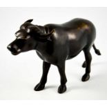 An Oriental bronze figure of a water buffalo