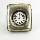 An Edwardian silver watch holder with pocket watch