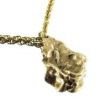 A naturalistic gold nugget pendant on 9 carat gold chain