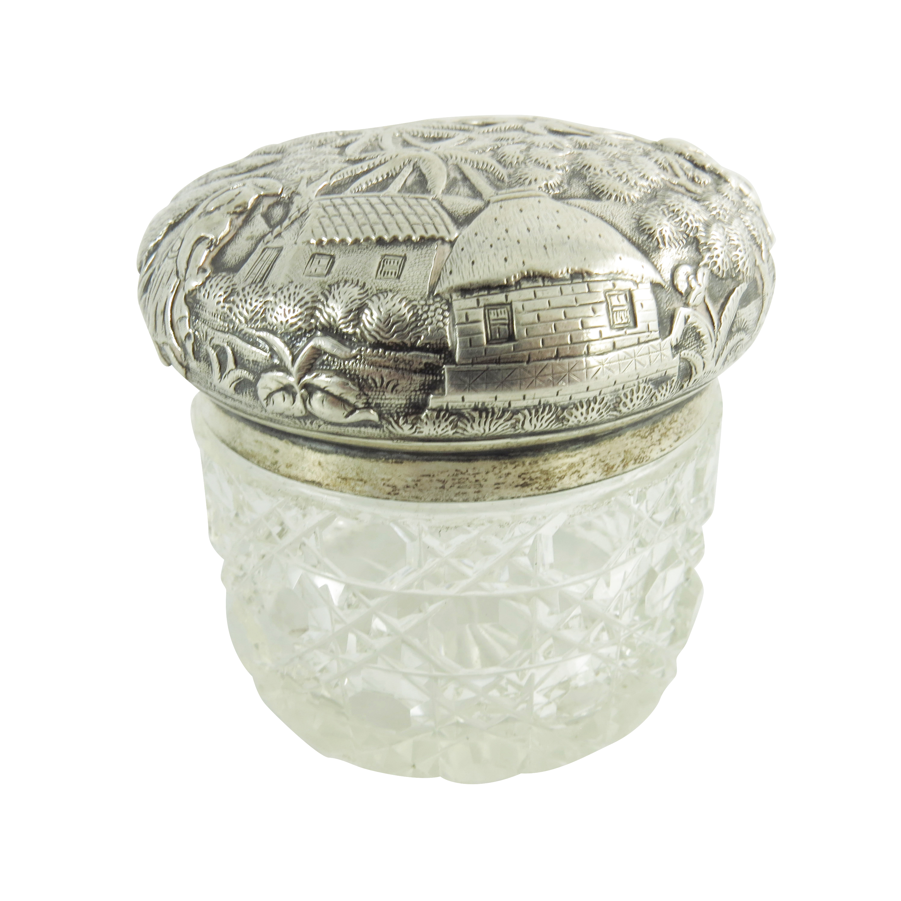 A 19th century Oriental white metal lidded cut glass jar